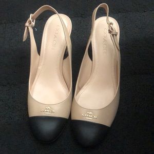 Coach Erica cap toe tan/black sling back, block pump heels.